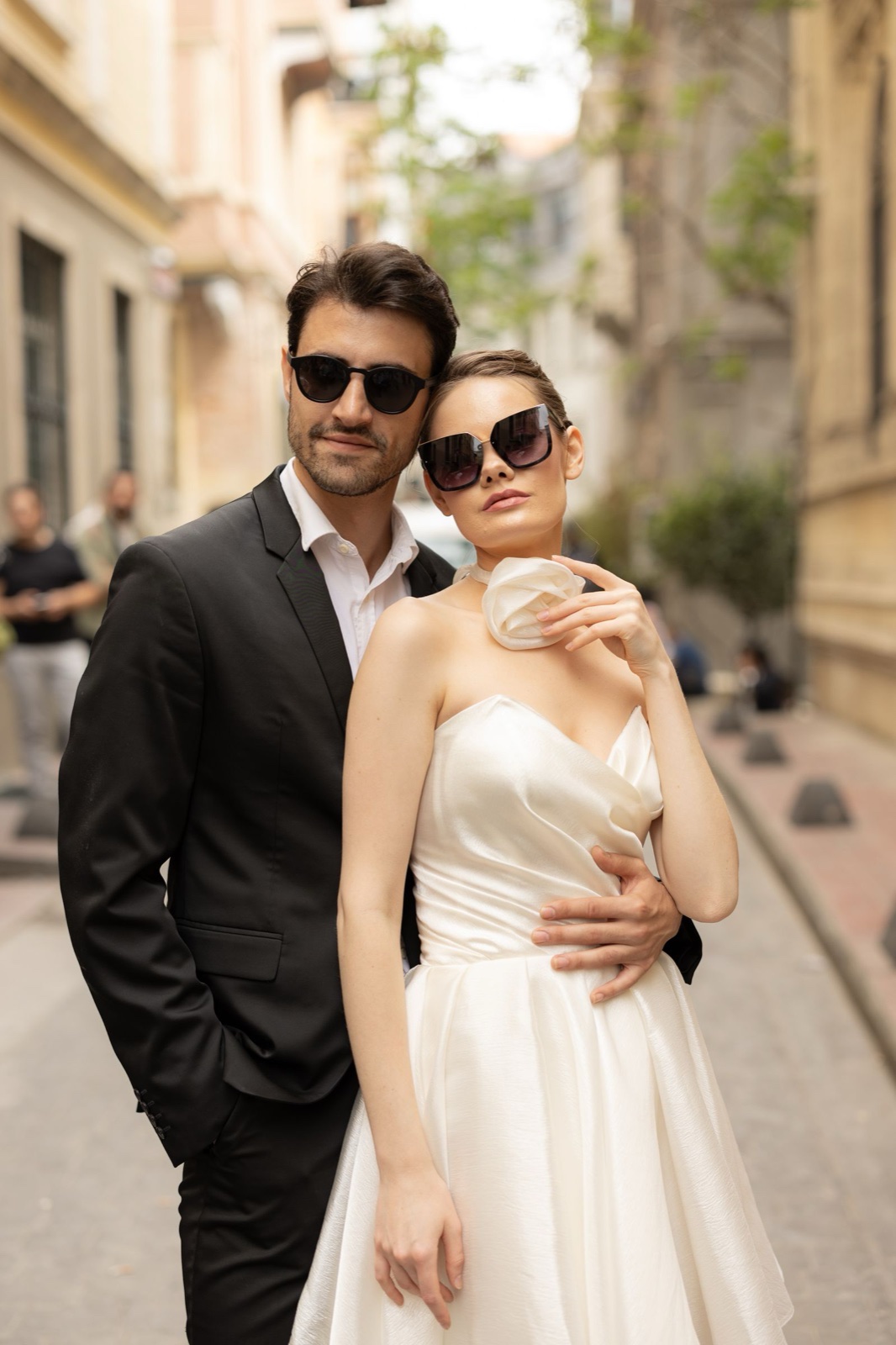 An elegant couple on a warm city street