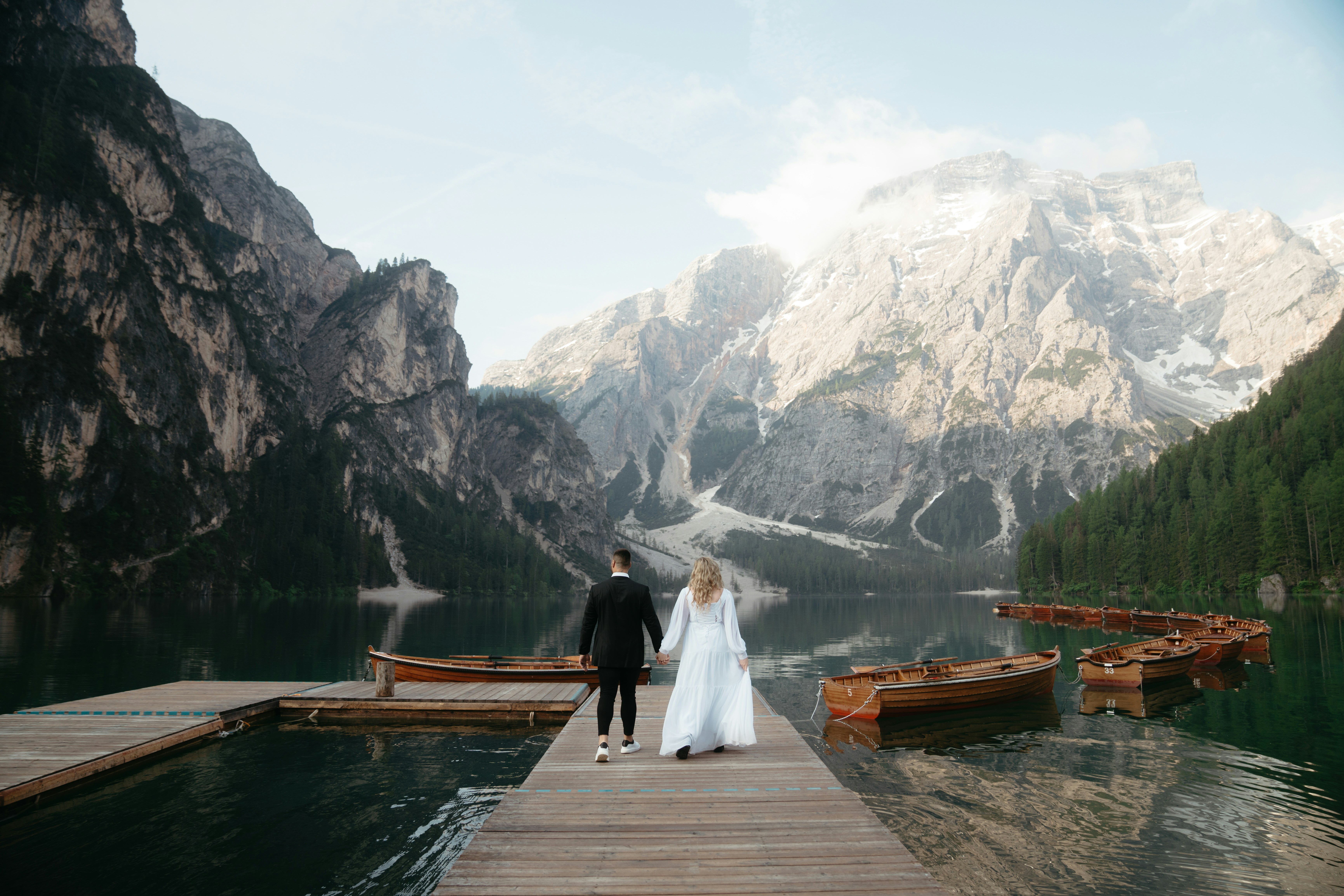 Newlyweds by an alpine lake