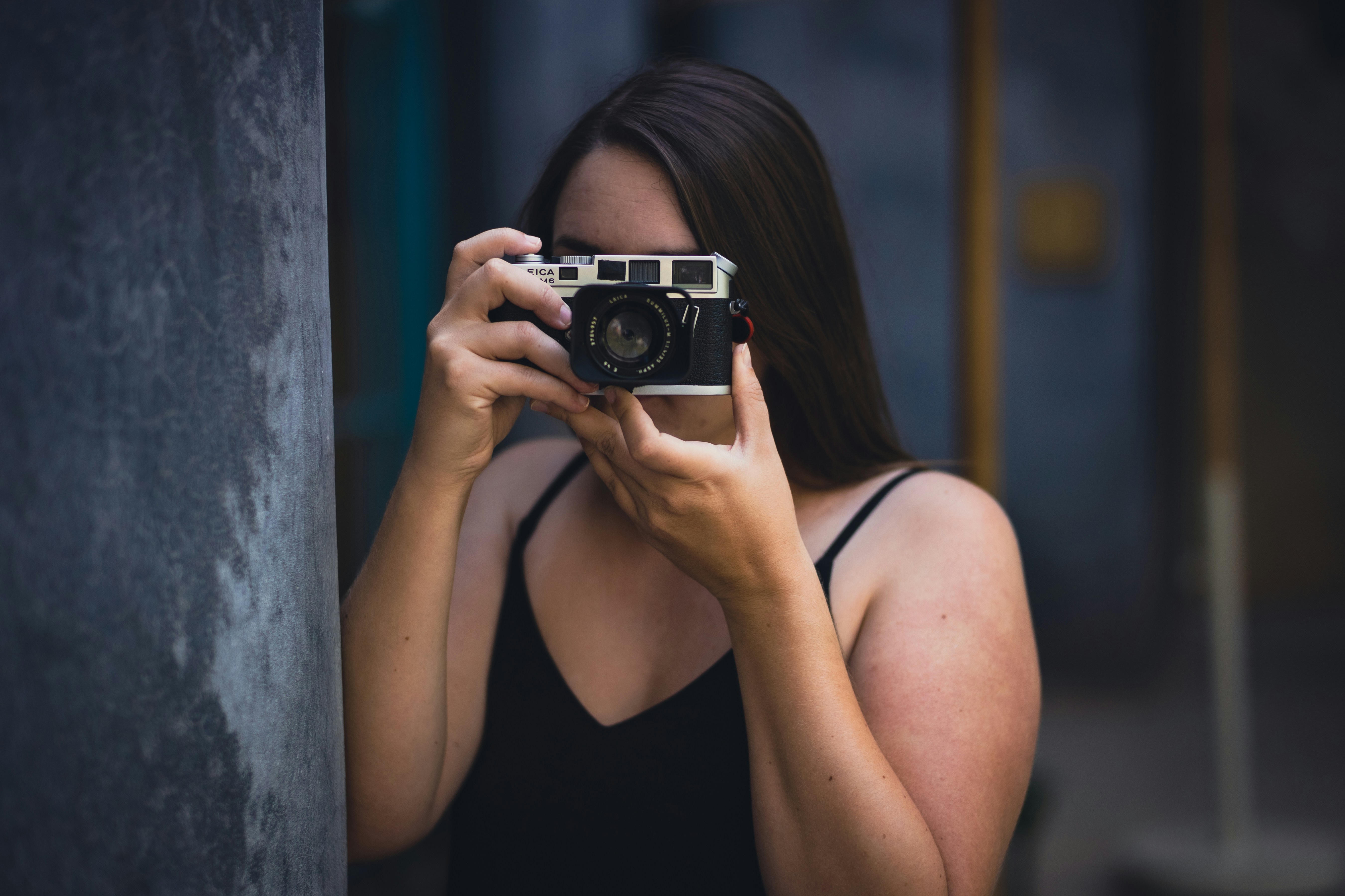 A photographer with a film camera
