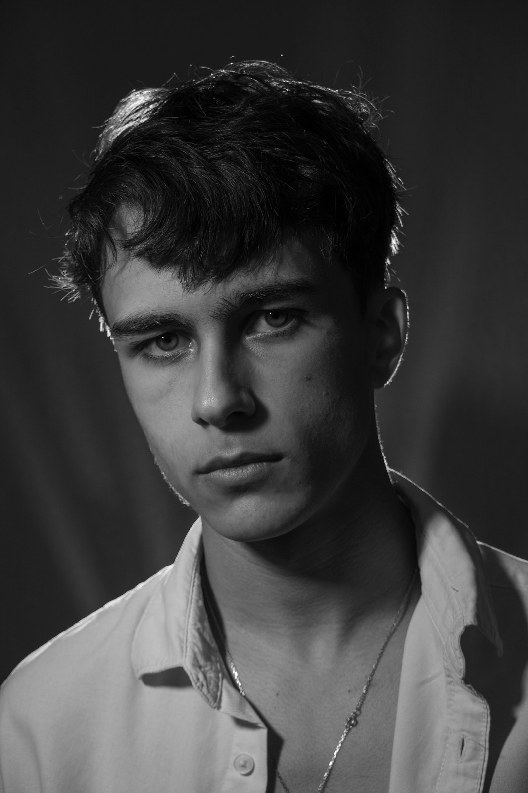 Black-and-white portrait in an ivory shirt