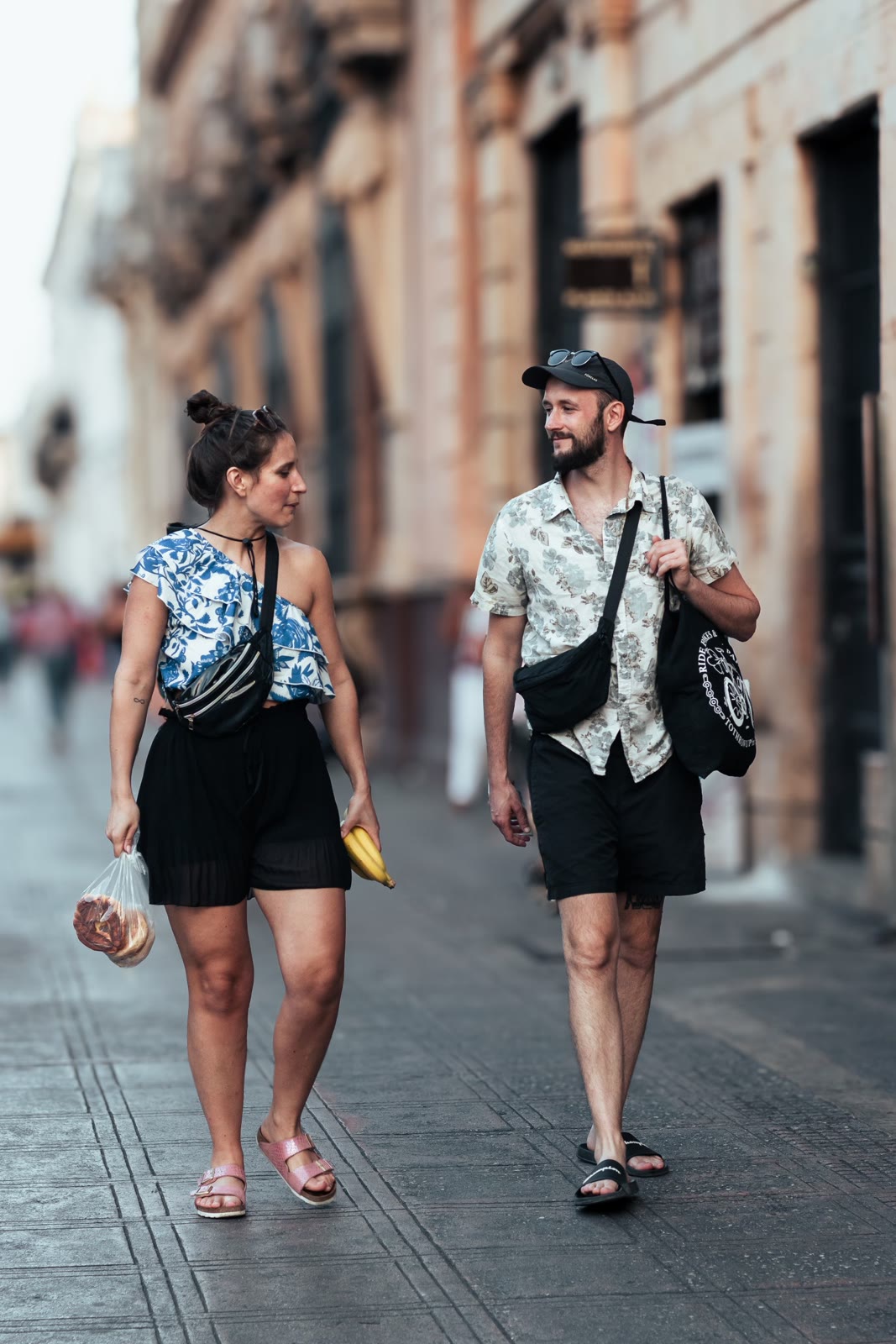 A couple walking through a city