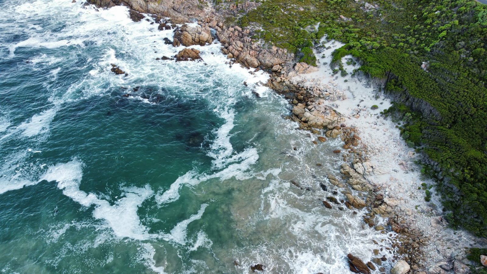 Turquoise water around a rugged coast