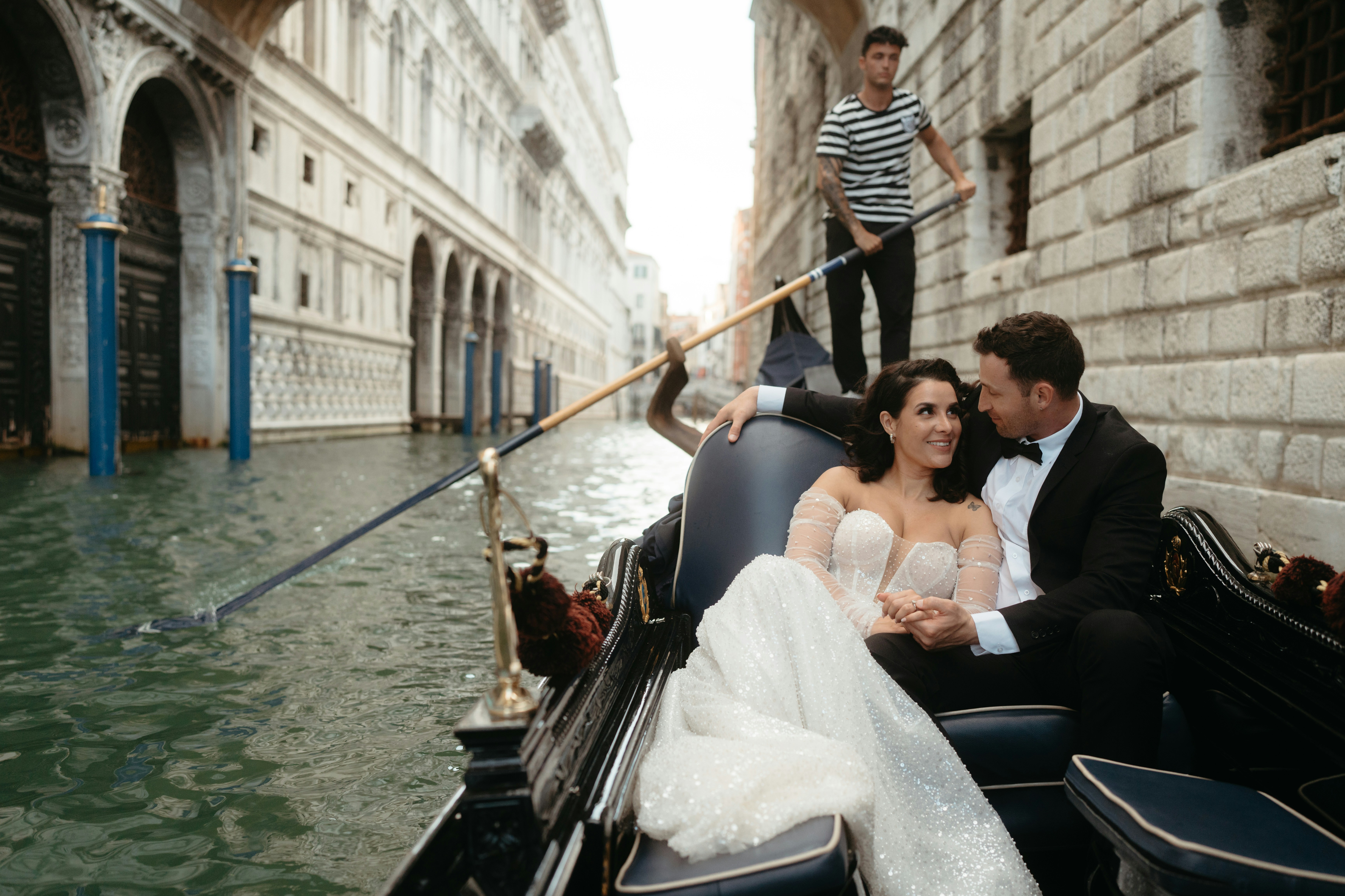 A wedding couple in a Venetian gondola
